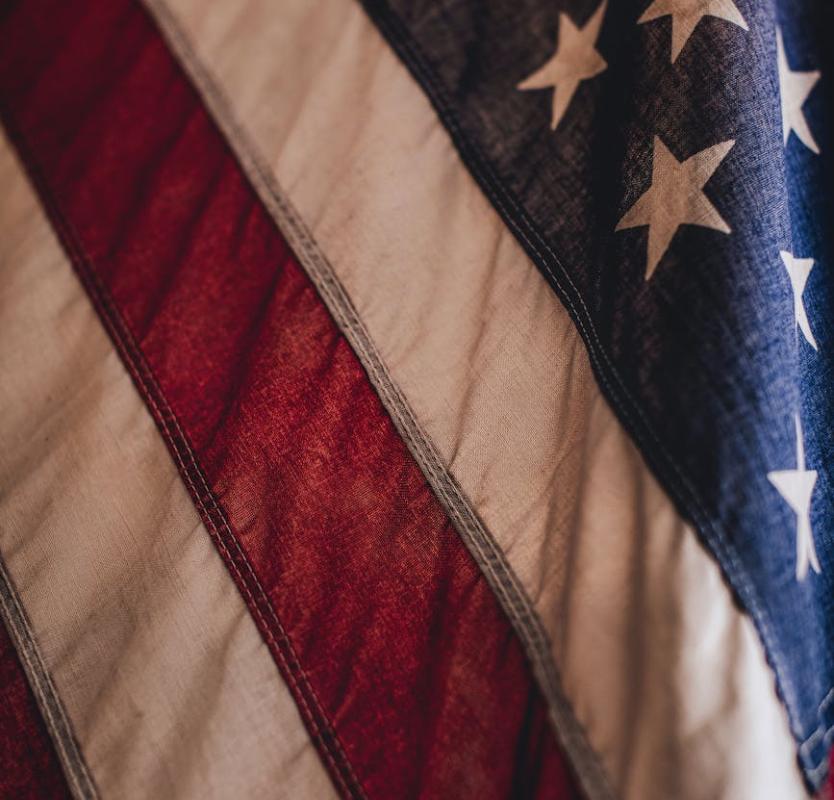 A detailed close-up of the American flag showcasing stars and stripes, ideal for patriotic themes.